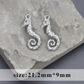 Rhodium-plated seahorse pendants with pavé zircons and 21.2mm x 9mm sizing - Seahorse Style A (M100325)
