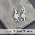 Silver seahorse pendants with white zircon inlays and closed loops, 19.4mm by 8.6mm - Seahorse Style B (M100326)