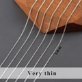 Détail d'une fine chaîne croisée de 1 mm plaquée rhodium pour la création de bijoux - 1.0mm / Chaîne Maille Forçat (C25909) / 3 Mètres / Rhodium