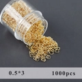 Επίχρυσοι ανοιχτοί κρίκοι 3mm 14k για DIY κοσμήματα 1000 τεμάχια σε διάφανο μπουκάλι - Μικροσκοπικοί Κρίκοι (M111301)