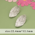 Silver irregular leaf earrings with brushed texture in size 22.4mm by 12.1mm - Silver