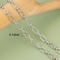 Bright silver 6.1mm rectangular chain links in polished metal on a wooden block - Rectangular with Small Round Bead Style (C6104) / 1m