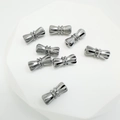 Silver bow-shaped screw clasps for jewelry making with faceted geometric design - Chrome