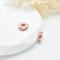 Rose gold plated spacers with infinity weave pattern and sparkling zircon crystals - 6mm / Rose Gold