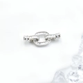 Chiusura per collana ovale argentata con zirconi baguette su base bianca - Oro bianco