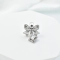 Silver bow pendant with sparkling cubic zirconia on a white geometric display stand - With Glue / White Gold