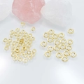 Golden twisted metal rings for jewelry making with elegant quartz crystal background - 4mm / Gold