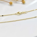 Detailed view of 18K gold plated necklace with textured round discs and lobster clasp - Sunflower Chain (1.2mm)
