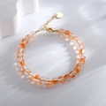 Pulsera estilo bohemio con cuentas naranjas agrietadas y cadena dorada ajustable - Naranja