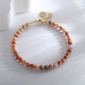 Minimalist beaded bracelet featuring orange marble stones and golden metal clasp - Red Grid Stone Bracelet