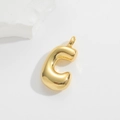 Macro detail of 3D balloon letter C pendant in polished gold with metallic sheen - Small Letter Pendant / Letter C