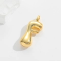 Close-up of polished gold bubble letter F pendant with a shiny mirror finish - Letter F