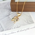 Macro shot of gold-plated letter R pendant with multi-colored zircon stones and heart bail - Pendant + Box Chain / Letter R