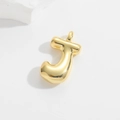 Macro view of a 3D bubble letter J pendant with high-shine gold-plated finish - Letter J