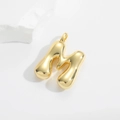 Detailed macro view of a 3D bubble style gold letter M pendant with mirror finish - M