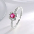 Elegant silver halo ring featuring a vibrant square-cut red zircon and pave accents - Silver Plated Red Zirconia