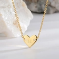 Elegant gold heart pendant necklace featuring an engraved letter H on a delicate chain - Letter H