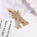 Gold plated letter A pendant with crown and pavé cubic zirconia on white satin - Gold Letter A Pendant Only (Without Chain)