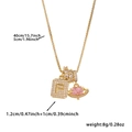 Detail of gold necklace with zircon square letter P, ring and pink planet pendants - Box Chain / Gold F