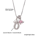 Detail of silver crown letter O pendant with pink heart planet charm and size specs - Silver Letter O Style