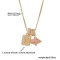 Macro shot of gold square letter I pendant with pink heart gemstone and zircon details - Box Chain / Gold I