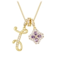 Detail of 18K gold-plated initial F necklace with purple gemstone floral pendant - Gold F