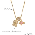 Detailed view of gold square letter S pendant with zircon accents and planet charm - Box Chain / Gold S