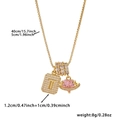 Macro detail of 18K gold plated necklace with cubic zirconia T-pendant and pink heart saturn - Box Chain / Gold T