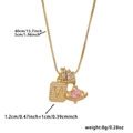 Detail view of gold square letter V pendant and pink heart saturn charm with zircons - Box Chain / Gold V