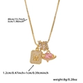Detail view of gold necklace with letter W pendant, pink heart stone, and size specs - Box Chain / Gold W