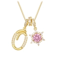 Macro detail of gold letter O pendant and pink snowflake charm with pavé zircon settings - Box Chain / Gold O