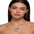 Silver letter necklace with blue heart gemstone and pavé diamonds worn by model - Silver U