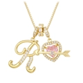 Macro shot of gold letter R pendant with pink heart zircon and sparkling crystal arrow - Letter R / Gold
