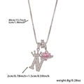 Macro detail of crown letter N pendant with pink heart planet and size specifications - Silver Letter N Style