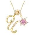 Detail of gold necklace featuring letter U pendant and pink sunflower zircon gemstone - Box Chain / Gold U