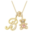 Close-up of golden bear pendant with pink heart and crystal letter B on a box chain - Gold B