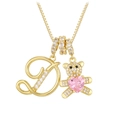 Macro view of gold letter D necklace with a sparkling teddy bear and pink heart gem - Letter D / Gold