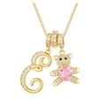 Detail of 18K gold teddy bear necklace with pink heart crystal and pavé letter E pendant - Letter E / Gold
