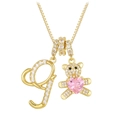 Macro detail of gold-plated J letter pendant and crystal bear charm with pink heart - Letter G / Gold