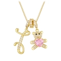 Detail of gold necklace featuring letter J and teddy bear pendant with pink heart stone - Letter I / Gold