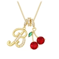 Macro detail of gold necklace featuring letter B pendant with zircon and cherry gemstone - Gold B (Pendant + Box Chain)