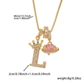 Detail of copper crown letter L and pink planet heart pendant on a box chain - Gold Letter L Style