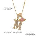 Detail showing 40cm+5cm gold chain with zircon M letter crown and pink saturn pendant - Gold Letter M Style