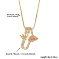 Detail view of gold letter U pendant with crown and pink heart planet on box chain - Gold Letter U Style
