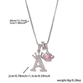 Detail view of crown letter A pendant with pink heart charm and 40 plus 5cm box chain dimensions - Silver Letter A Style