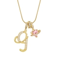 Close-up of golden necklace with crystal letter G and pink heart-shaped planet pendant - Letter G Heart Planet Necklace (With Stainless Steel Snake Chain) / Gold