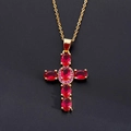 Detailed macro view of a gold cross pendant featuring five oval red zircons on black background - Red