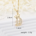 Macro shot of 18k gold plated crown letter D pendant with cubic zirconia and dimensions - Gold D