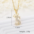 Macro view of 18k gold plated crown letter S pendant with zircon micro-paving details - Gold S