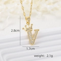 Macro shot of crown initial V pendant with dimensions 2.8cm by 1.7cm in gold finish - Gold V
